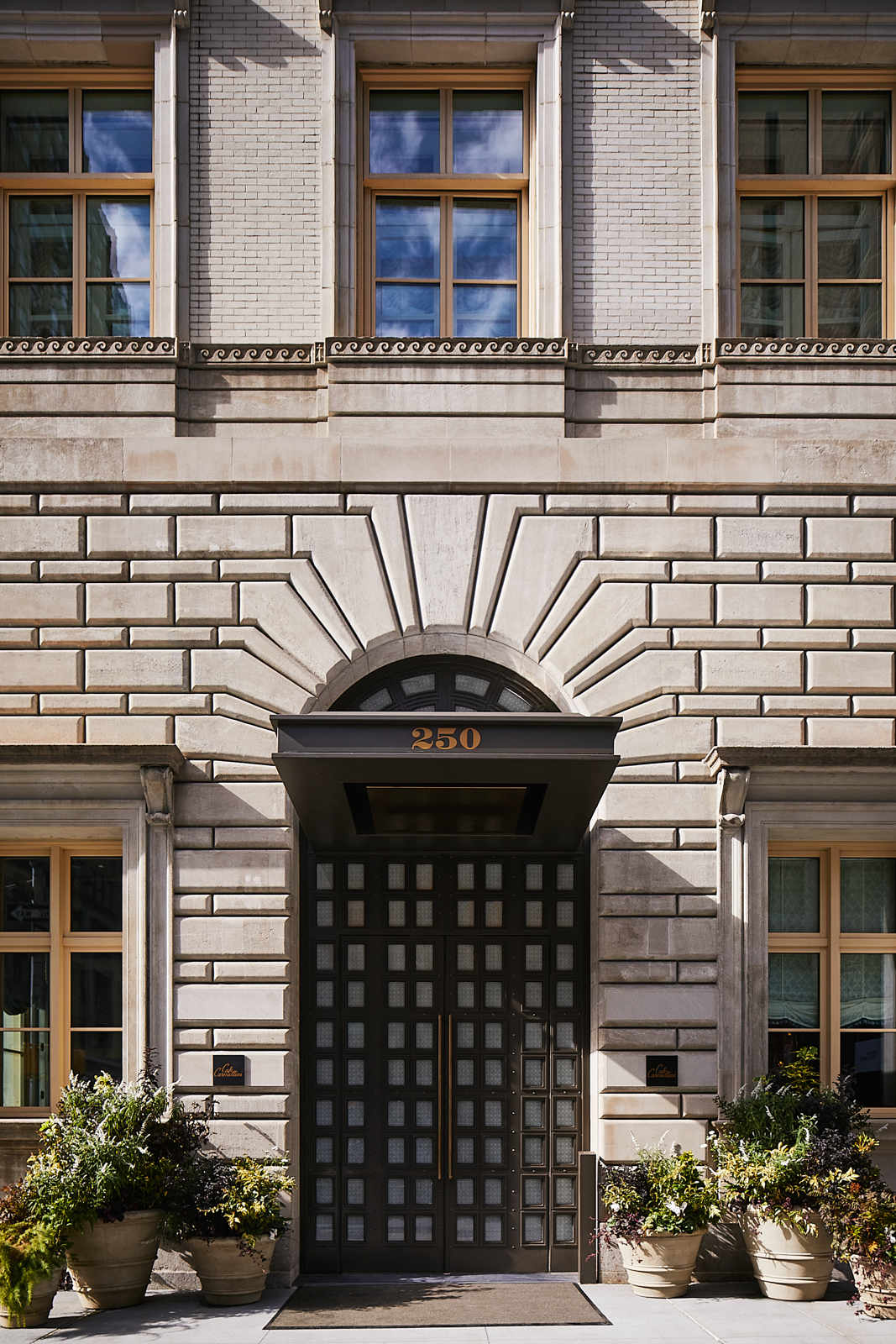 The Fifth Ave Hotel's exterior boasts an impressive architectural design.