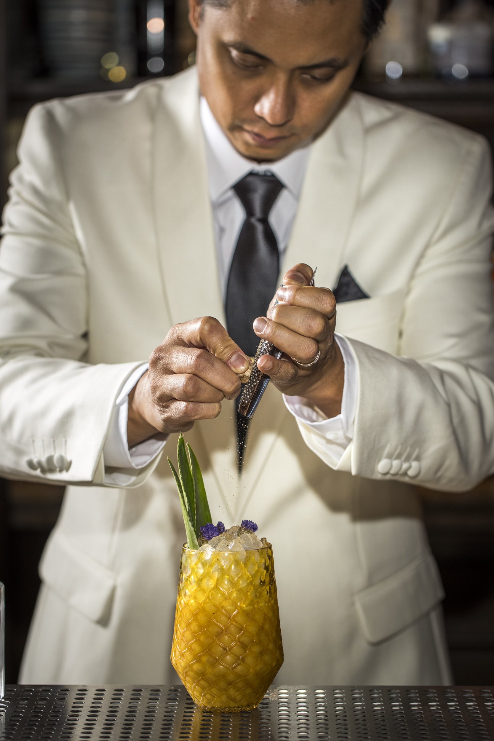 A bartender focuses on making Medsker juice.